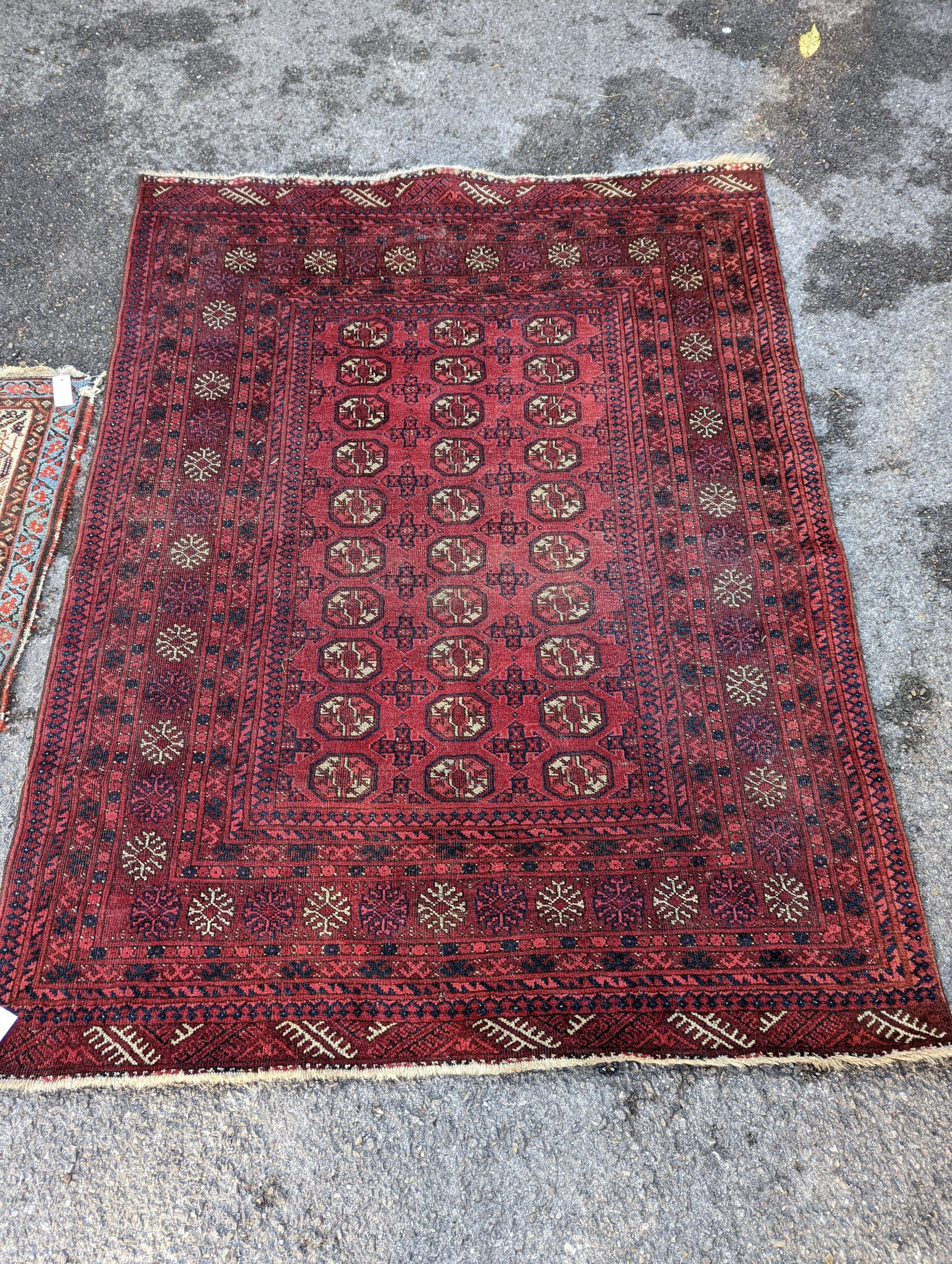 A Bokhara red ground rug, 176 x 135cm